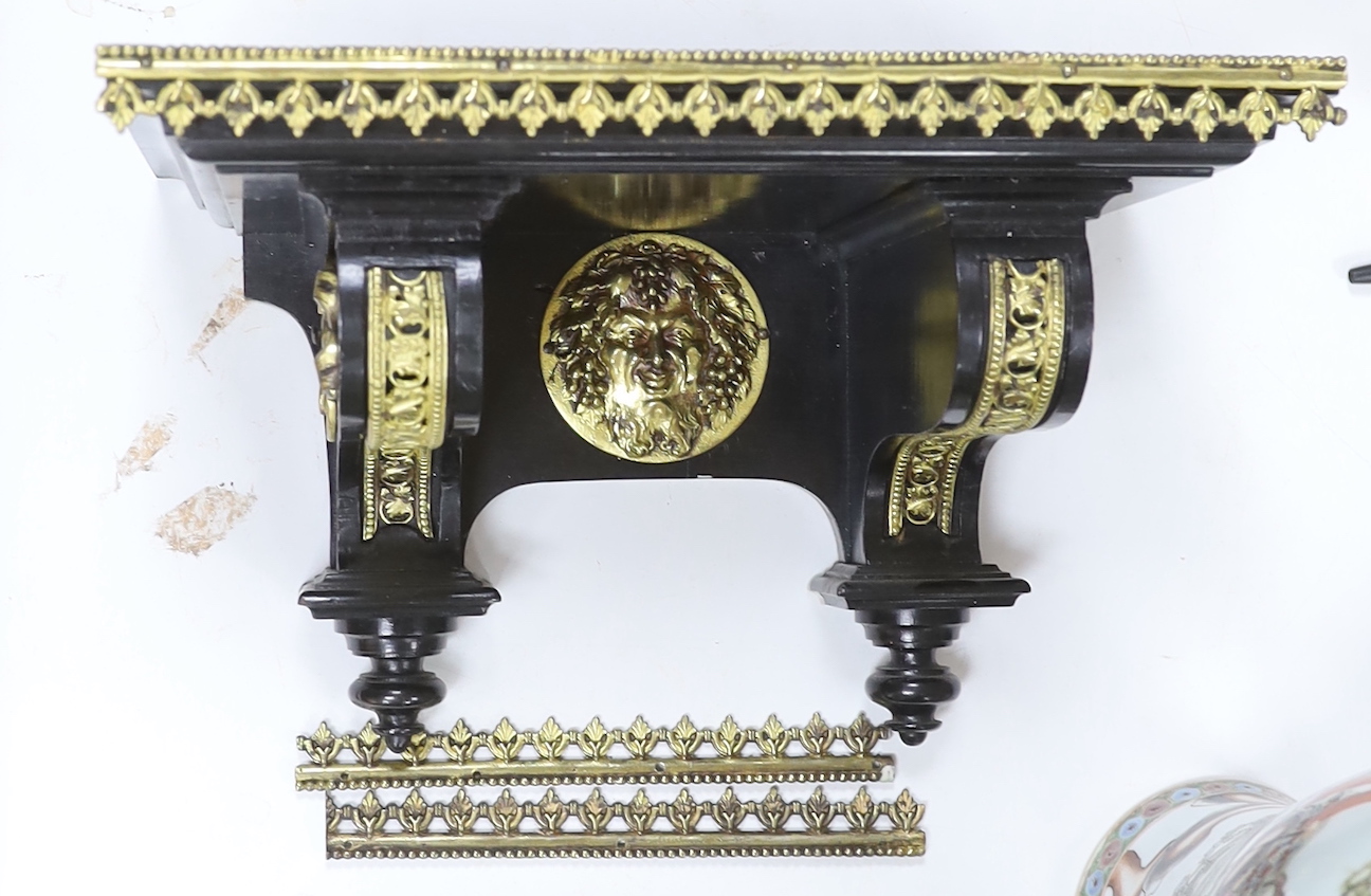 An ebonised German bracket clock with brass decoration, with a Lenzkirch movement striking on a coiled gong, 53cm high, with bracket